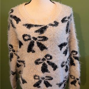 Elegant Black and Cream Bow Sweater